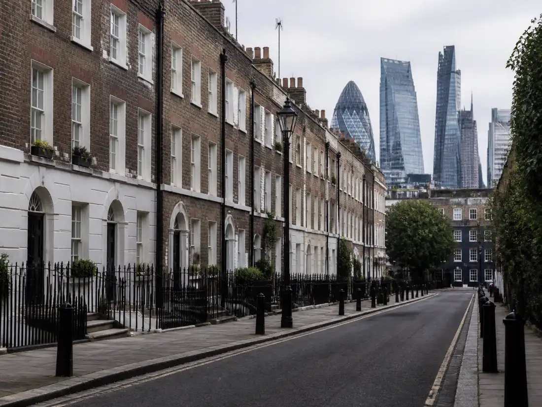 Georgian London terraces framed against the City of London skyline
